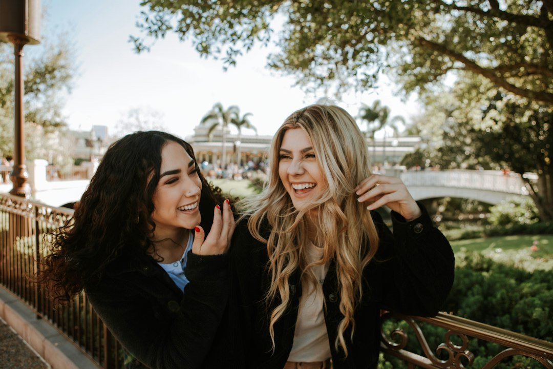 Two women laughing together outdoors