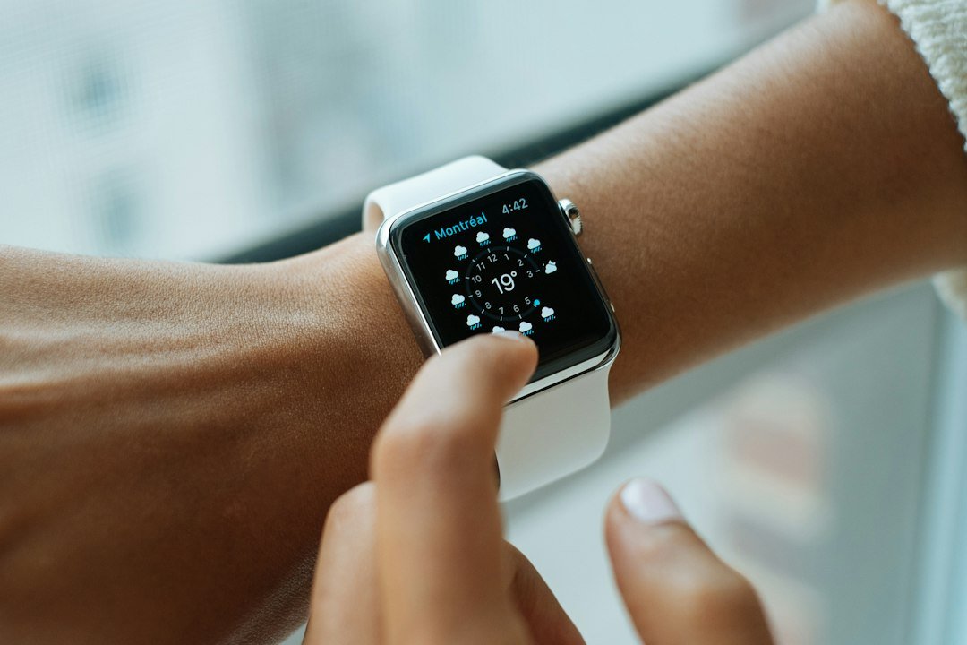 Woman using a smartwatch and smartphone