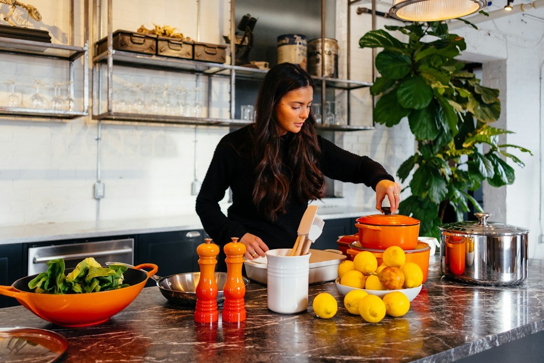 Woman preparing food in a home kitchen