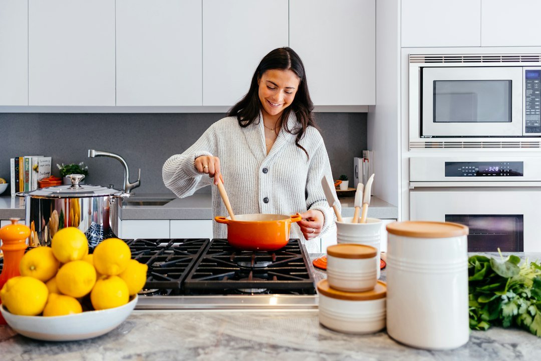 Woman cooking in a bright home kitchen
