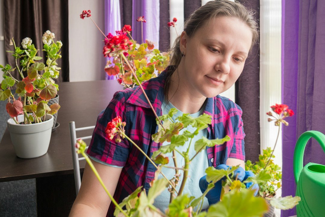 Woman gardening among flowers outdoors