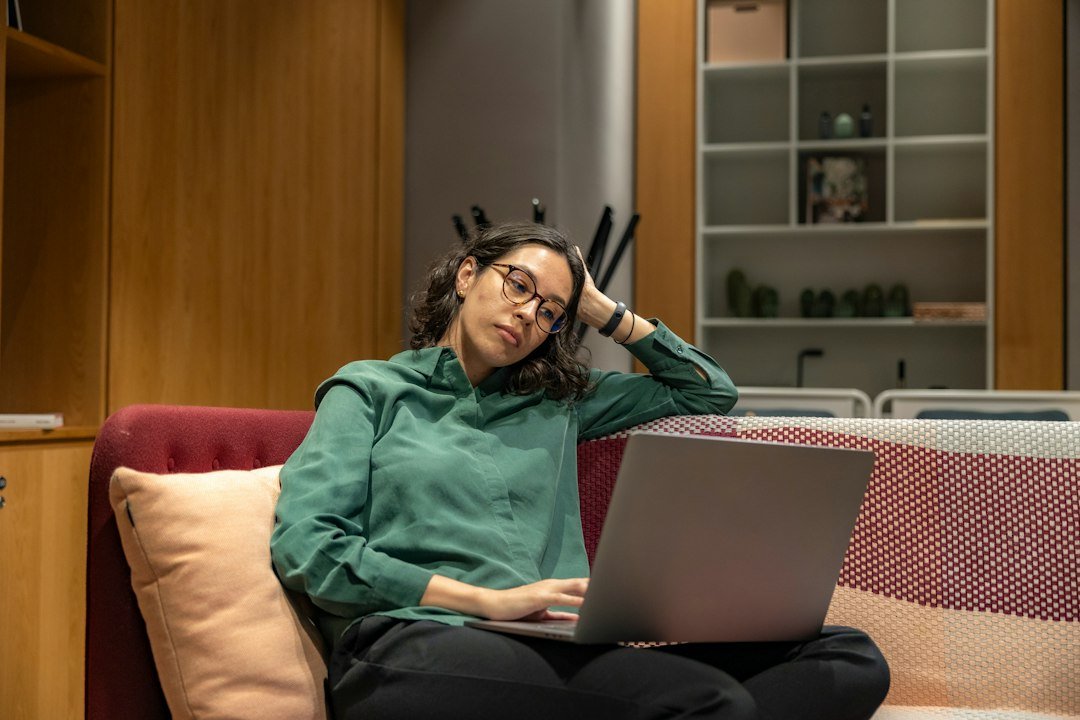 Woman using a laptop in a relaxed home workspace