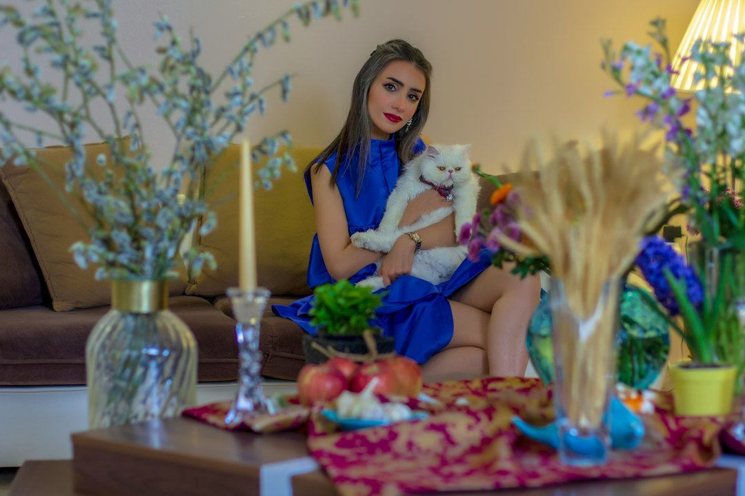 Woman relaxing at home with her cat