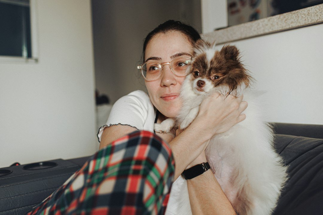Woman relaxing at home with her dog
