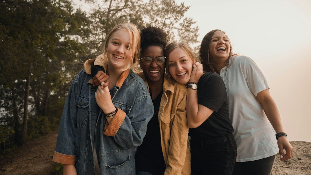 Women of different ages laughing together outdoors